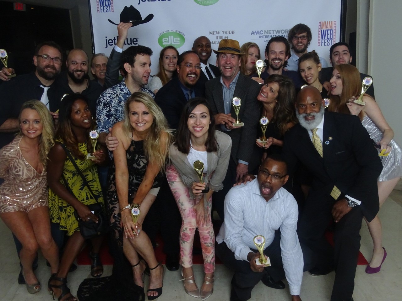 Award night winners celebrating with trophies