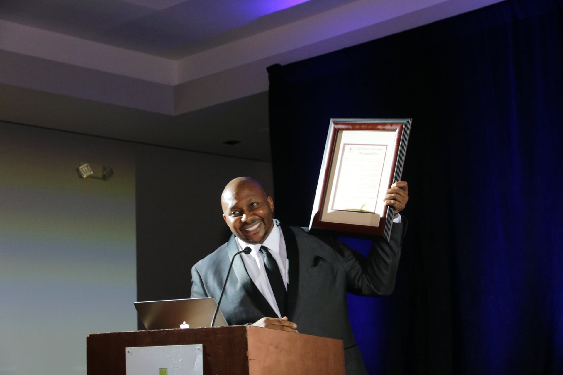 Bryan Thompson, Co-Founder, receiving a proclamation